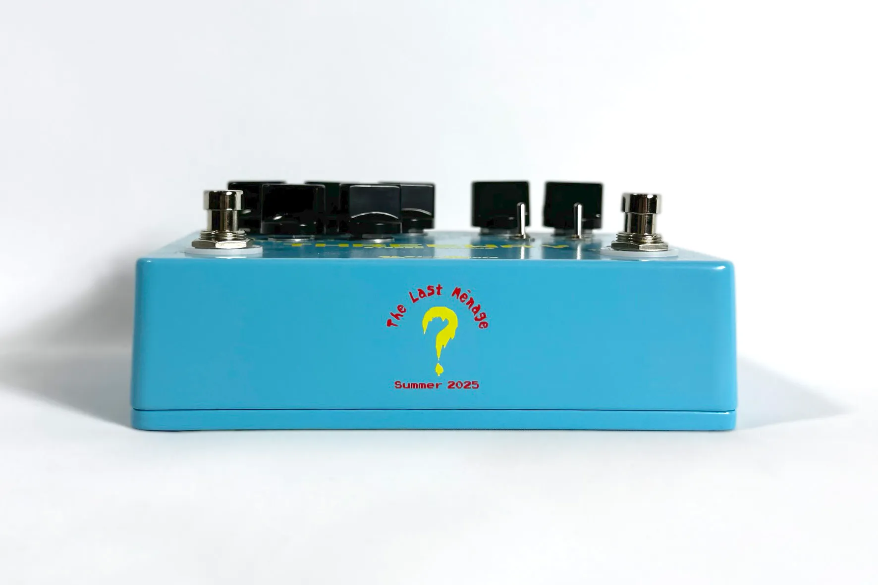Front view of a light blue The Last Ménage Threeway stereo chorus pedal.